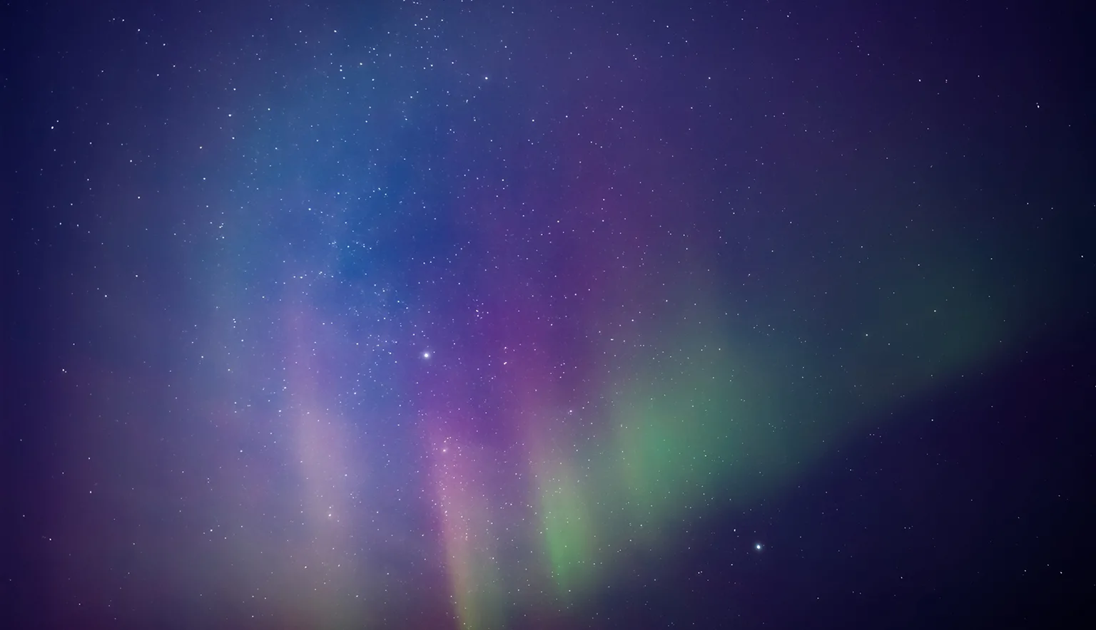 Aurora borealis, polar lights with Milky Way stars.