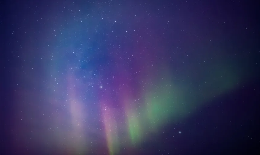 Aurora borealis, polar lights with Milky Way stars.
