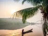 Paddling in traditional wooden canoe