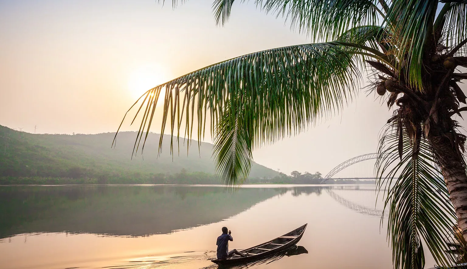 Paddling in traditional wooden canoe