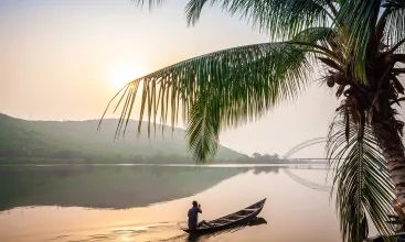 Paddling in traditional wooden canoe
