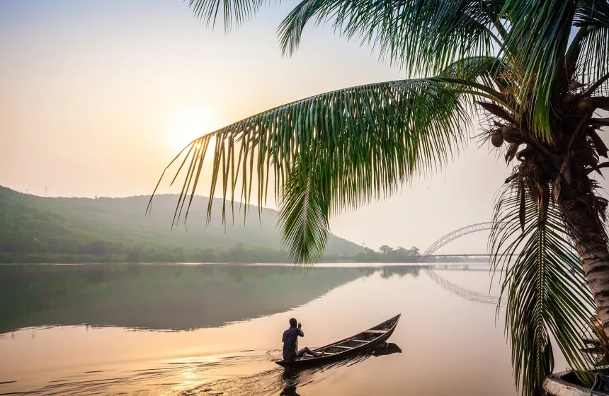 Paddling in traditional wooden canoe