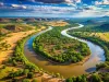 Aerial View Of The Limpopo River Winding Through The African Landscape