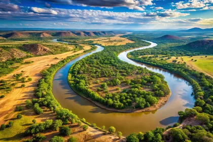 Aerial View Of The Limpopo River Winding Through The African Landscape