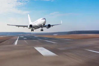 Plane above runway