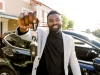 Portrait of man car seller holding car keys.