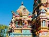 Colourful Indian temple in Mauritius Island. Close-up on sculptures and statues of deities.