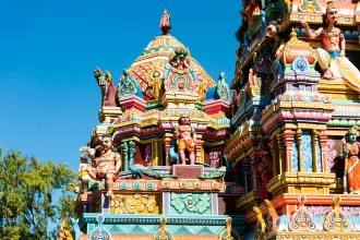 Colourful Indian temple in Mauritius Island. Close-up on sculptures and statues of deities.