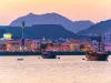 View of coastline of Muttrah district of Muscat during sunset, Oman.