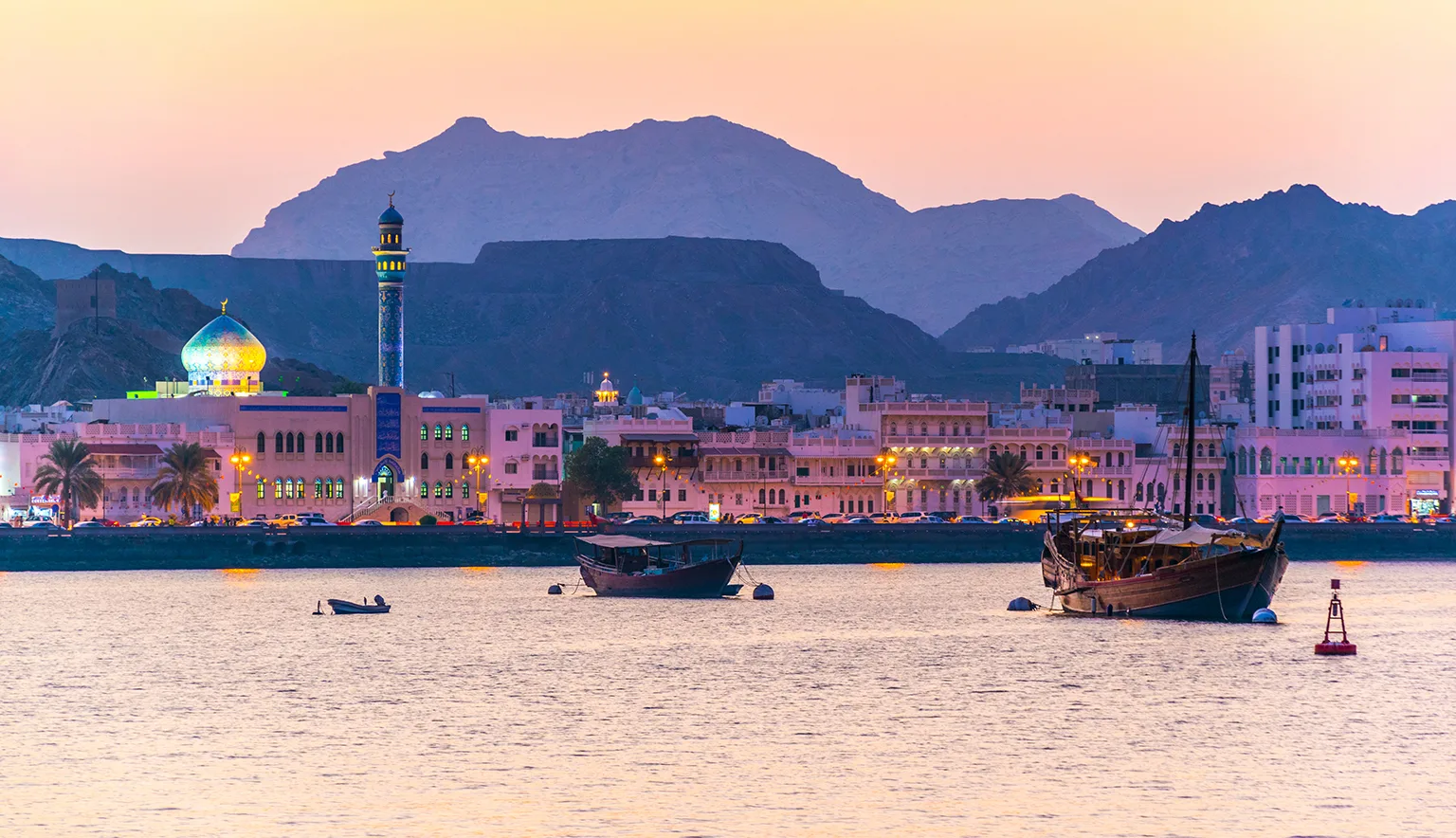 View of coastline of Muttrah district of Muscat during sunset, Oman.