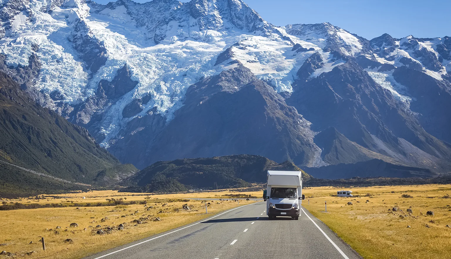 campervan on road with mountain view