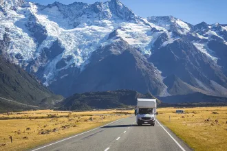 campervan on road with mountain view