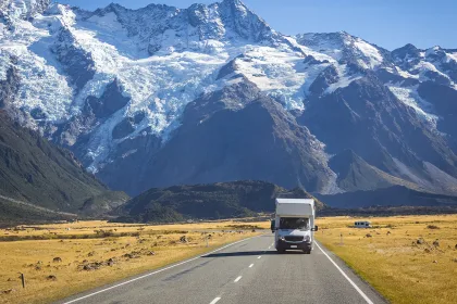 campervan on road with mountain view