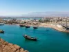 Traditional wooden dhow boats and the shipbuilding district in Sur, Oman