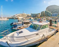 Sailboats, motorboats, and super yachts moored at Ocean Village, Gibraltar