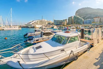 Sailboats, motorboats, and super yachts moored at Ocean Village, Gibraltar