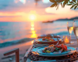 dinner served on the beach by the sea