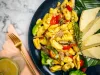Ackee and Saltfish with Breadfruit in Dark Blue Plate - Closeup