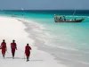 Masai, entertaining tourists on the beach in Nungwi. Zanzibar