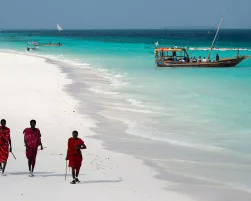 Masai, entertaining tourists on the beach in Nungwi. Zanzibar