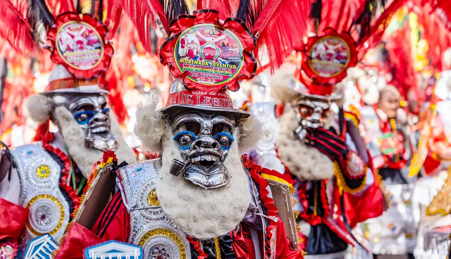 man in red mask at The festival of the Santísima Trinidad