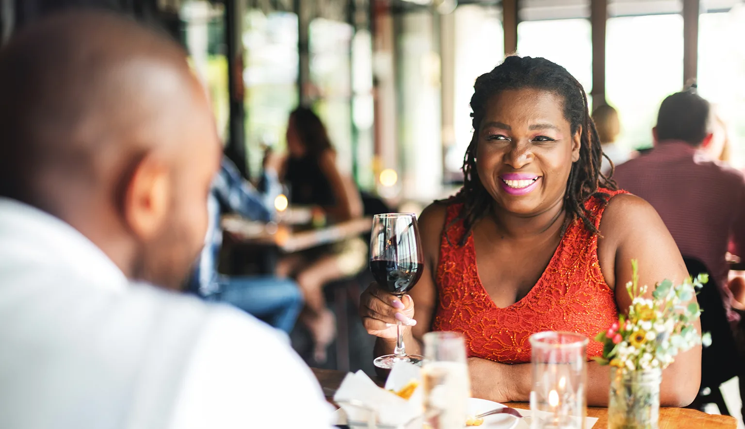 Woman enjoying wine at a restaurant