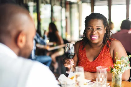 Woman enjoying wine at a restaurant