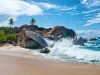 Water Splash at Virgin Gorda Island with Big Rocks, Plants and Trees on a Tropical Climate.