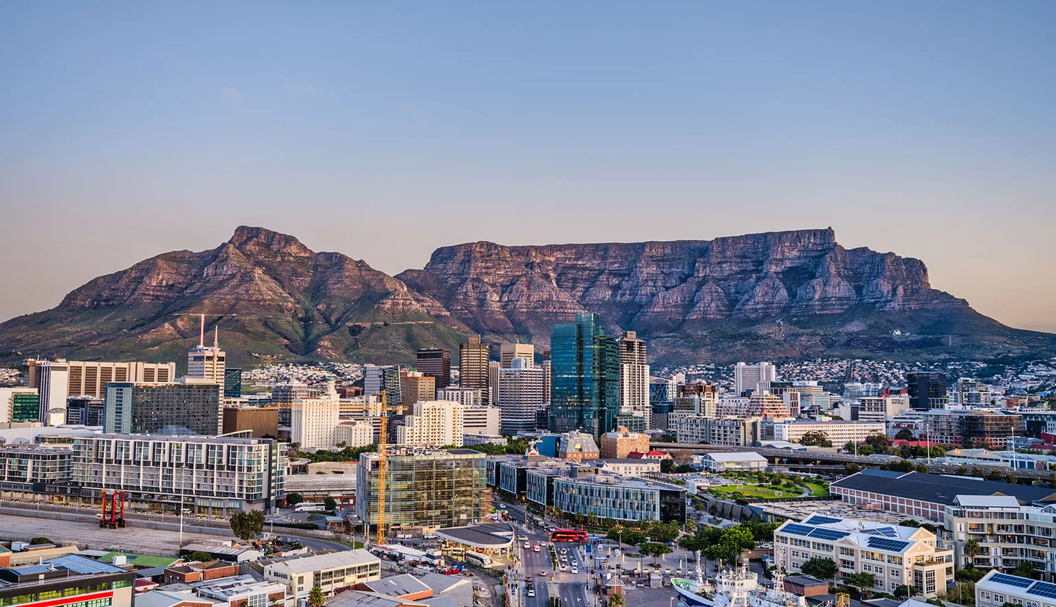 Wide angle shot of Cape Town city central business district and table mountain in the background during sunset, South Africa