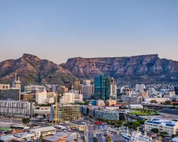 Wide angle shot of Cape Town city central business district and table mountain in the background during sunset, South Africa