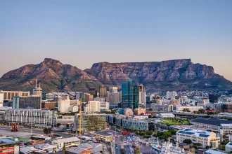 Wide angle shot of Cape Town city central business district and table mountain in the background during sunset, South Africa